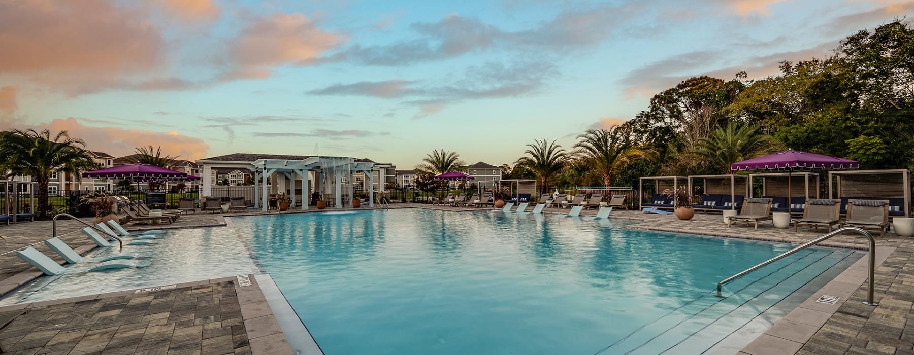 a pool with a building in the background